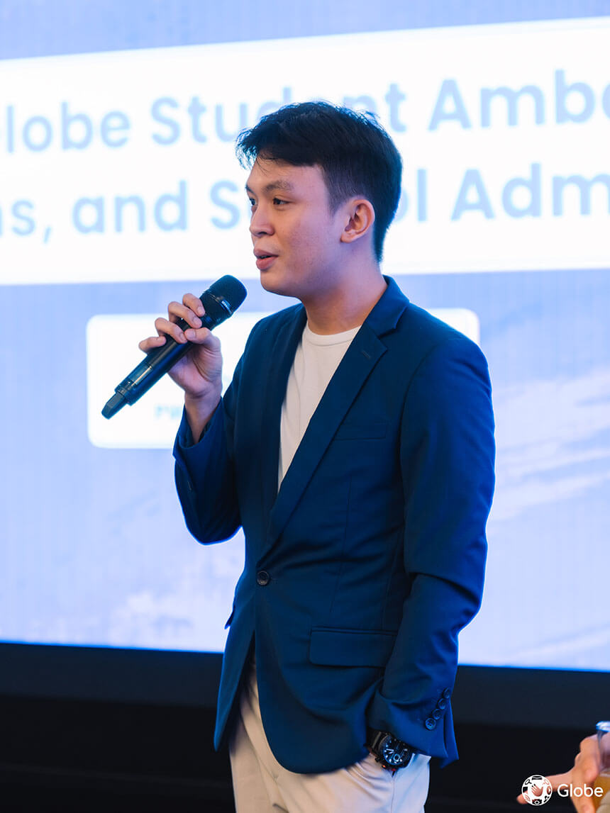 Landon Peralta, a Globe intern, presenting on stage