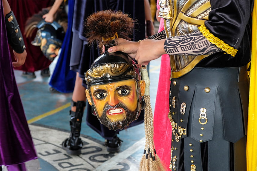 A participant holds a Morion mask during Holy Week in Boac, Marinduque.